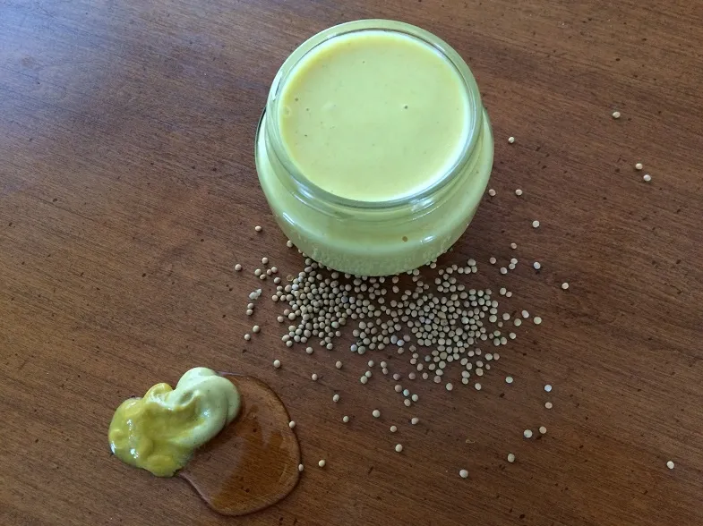 gluten-free-honey mustard sauce with ingredients around it